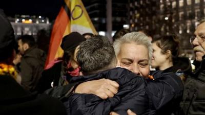 People hug as same-sex marriage becomes law