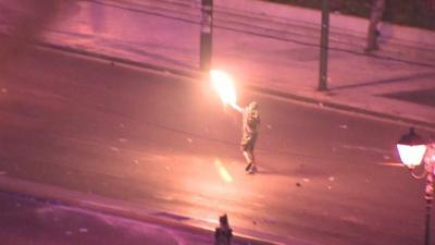 Protester throws petrol bomb