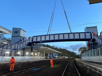 Cranes putting bridge in place