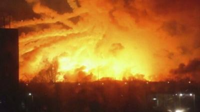 A fire rages at a military ammunition depot in Ukraine