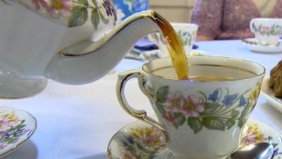 Teapot pouring tea