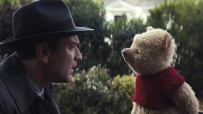 Ewan McGregor (L) and Winnie the Pooh (R) in a scene from Christopher Robin