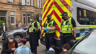 Protesters block immigration van from leaving Glasgow street