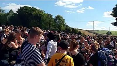 Crowds queuing for Boomtown Fair