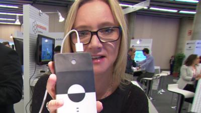 BBC Click's Kate Russell holds a graphene powered charger pack