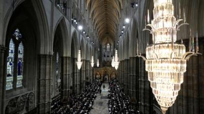 Guests and officials begin to take their places prior to the funeral service of Queen Elizabeth II at Westminster Abbey