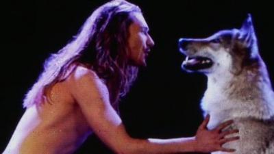 Man singing to a wolf