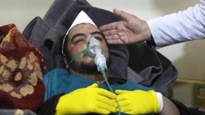 Syrian man in gas mask