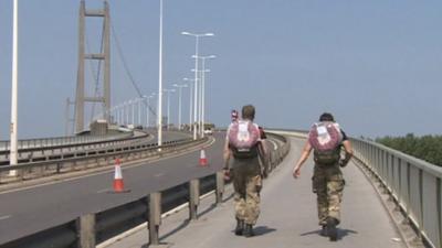 Soldiers walking across Humber Bridge