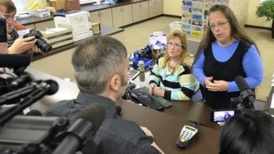 Rowan County Clerk Kim Davis, right, talks with David Moore following her office's refusal to issue marriage licenses at the Rowan County Courthouse