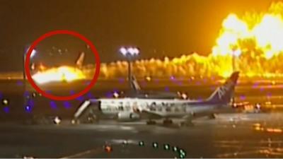 Plane engulfed in flames on airport runway in Tokyo