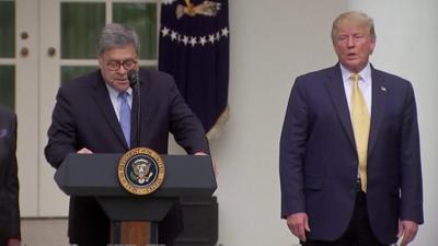 Attorney General William Barr, standing alongside President Trump