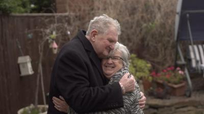 Miles Darcy hugging his wife Anne