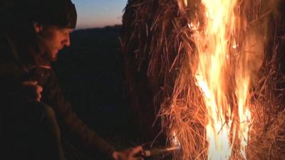 Winemakers in France light fires