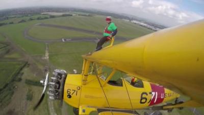 Mary Purser on top of the plane