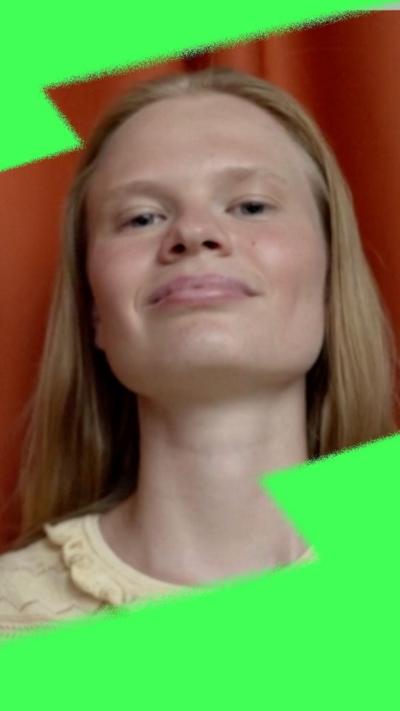 Woman with blonde hair in a yellow top
