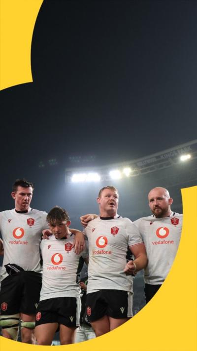 Wales players gather after defeat in Durban