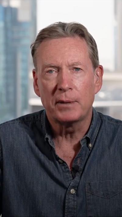 Frank Gardner wearing a blue shirt 