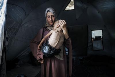Gaza mother cradling baby