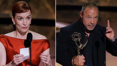 A composite image of Britt Lower, whose red hair is in a ponytail, wears a red silk dress during her acceptance speech, while Stephen Graham wears a black suit and black shirt as he points upwards while accepting his award 