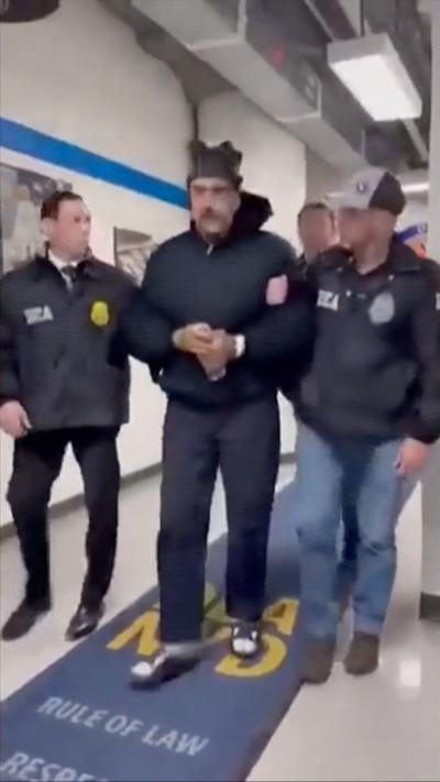 Screengrab of video shows Maduro escorted by DEA officers