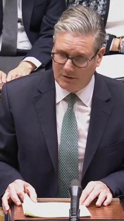 Keir Starmer speaks from behind a lectern in the House of Commons in London.