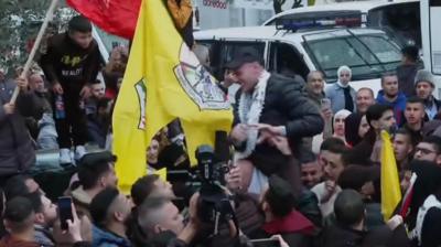 Released prisoner riding on shoulders