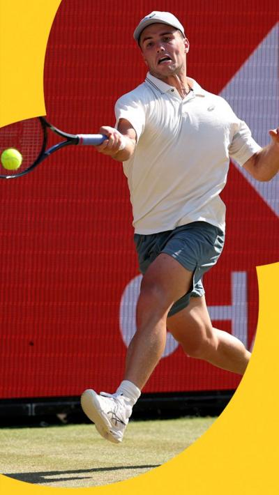 Arthur Fery hits ball with racket