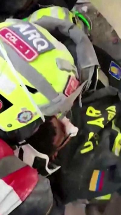 Emergency services pull boy from rubble