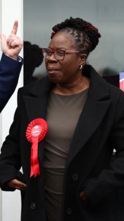 Labour MP Paulette Hamilton wearing a red Labour badge