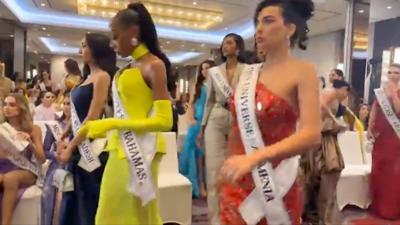 Miss Universe contestants walking out of pre-competition event