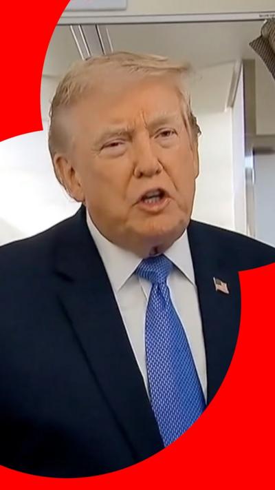 Trump stands in doorway inside Air Force One