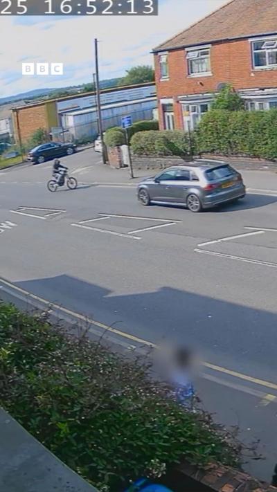 Car driving down street