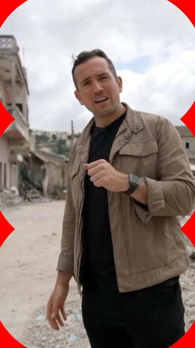 Hugo Bachega stands among ruins in southern Lebanon 