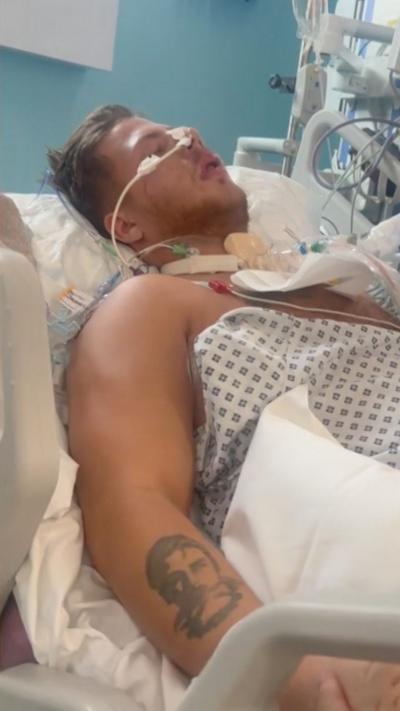 A man laying in a hospital bed.