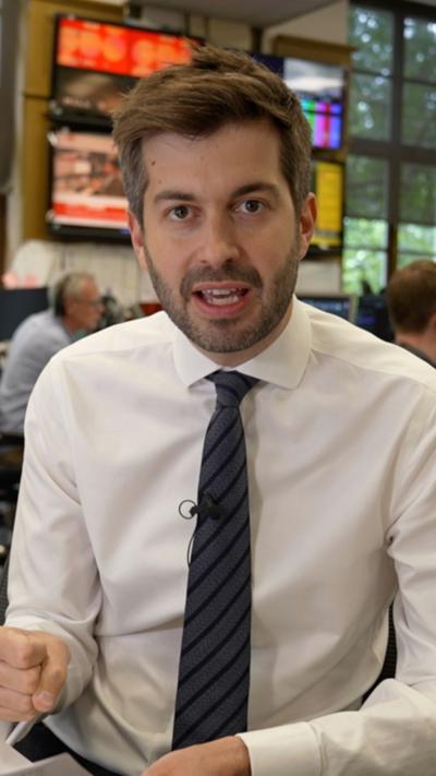 Joe Pike wears a white shirt and black tie
