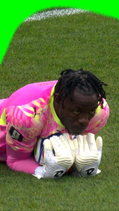 Benjamin Asare holds the ball as he protects his goal against England for Ghana