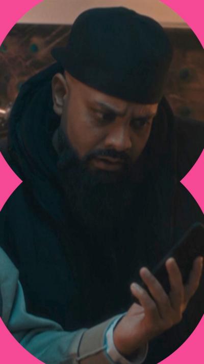 Man looking at phone with a shocked expression 