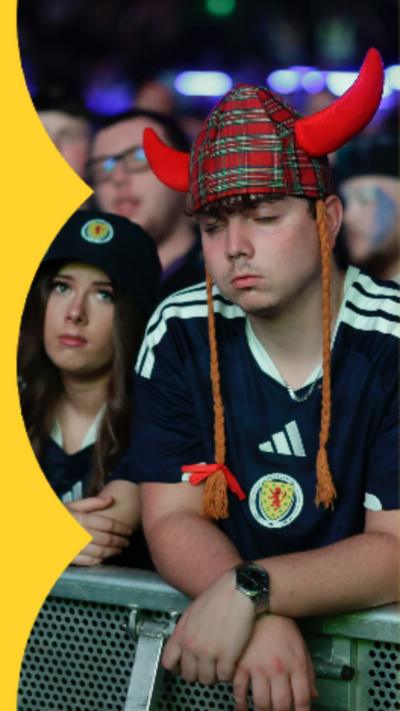 Disappointed Scotland fans in fan zone.