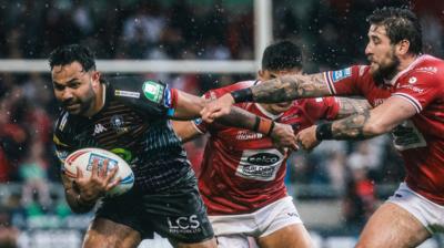 Bevan French makes a break for Wigan on the way to scoring against Salford