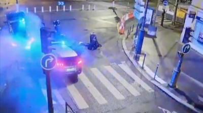 Two vehicles piled-up as police officer holds man on the ground