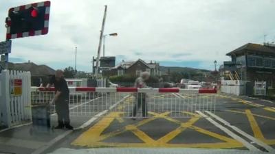 Woman on level crossing