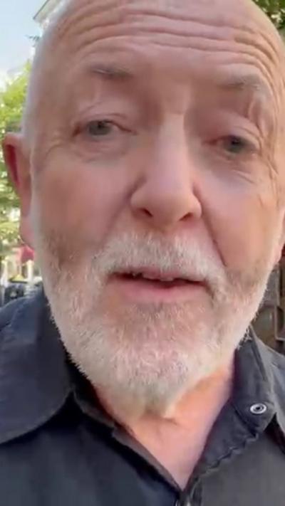 Jeremy Bowen in a close up - he is wearing a dark shirt 
