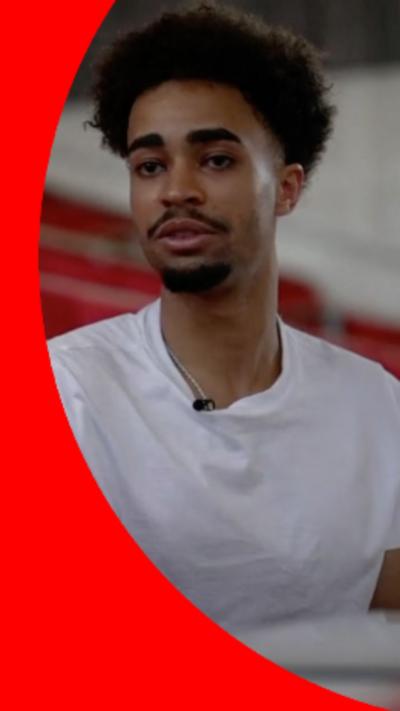 Young man wearing a white shirt during sit-down interview