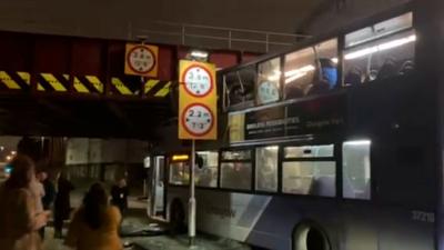 The bus crashed into a bridge on Cook Street, at the junction with Commerce Street