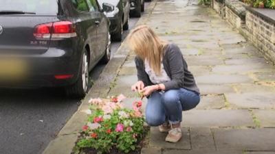 Woman planting a mini garden