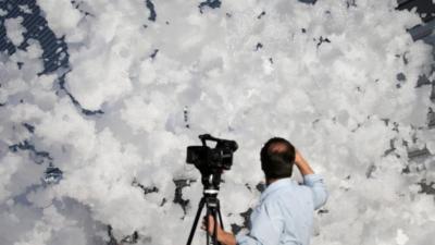 Cameraman in front of foam