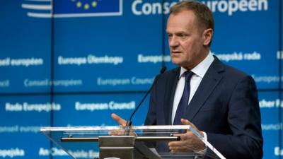 European Council President Donald Tusk speaks during a media conference at an EU summit in Brussels on Friday, Feb. 19, 2016.