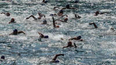 Swimmers compete in the Bosphorous river as they take part in the Bosphorus Cross Continental Swim