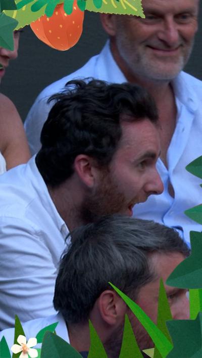 spectator opening champagne bottle